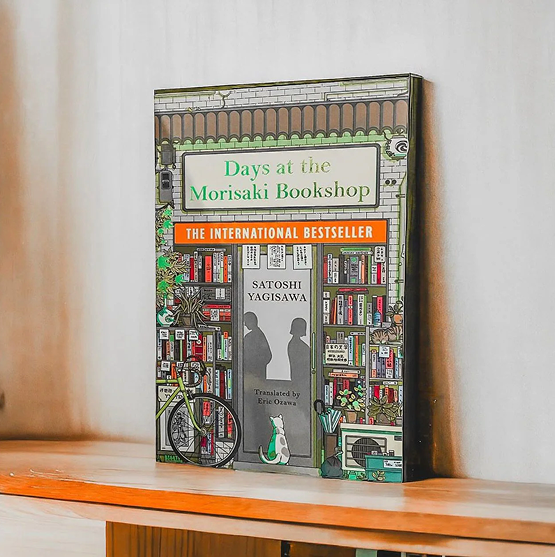 Person sitting on floor working on laptop