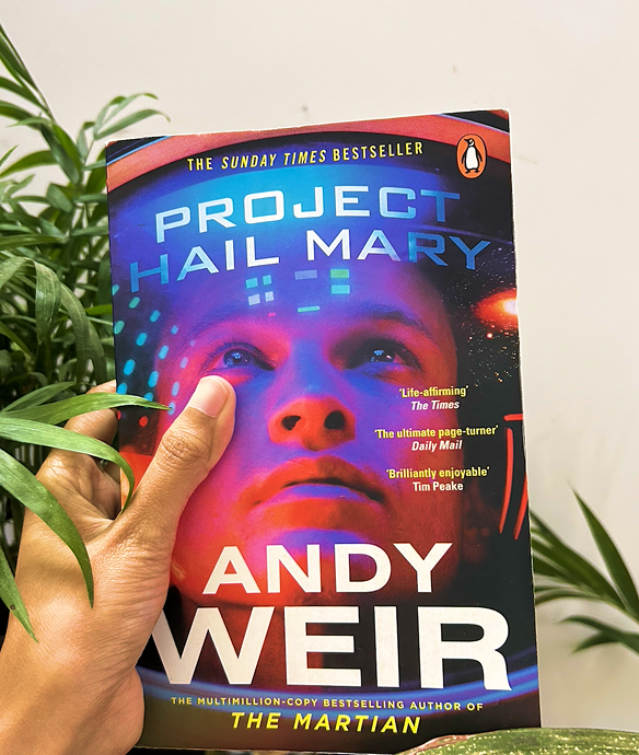 Person at standing desk working on laptop